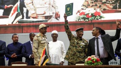 Sudanese officials celebrate the formation of the Sovereign Council in Khartoum.