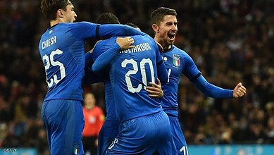 Italy football team celebrating a goal during a match.