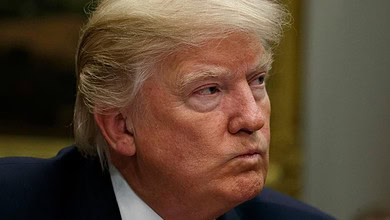 Image of Donald Trump with a focused expression, related to political and election interference topi.