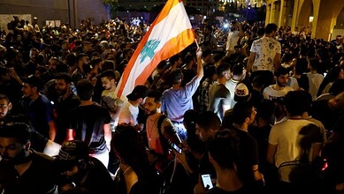 Protesters in Lebanon demonstrate against increased taxes and political corruption, demanding econom.