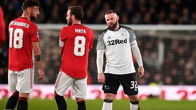 Manchester United players celebrating during a match, focusing on team success.