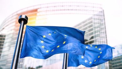 European Union flags waving in front of European Commission.