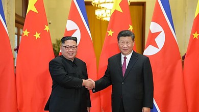 شي جين بينغ وكيم جونغ أون