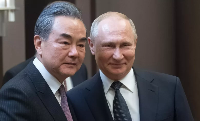 بوتين مع وانغ يي