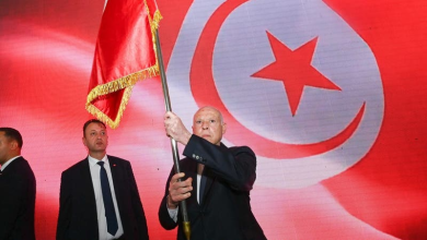 Kais Saied raises the country's flag