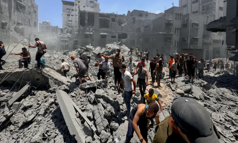 Palestinians search for survivors under the rubble of homes bombed by Israeli fighters in Gaza City in the central Strip. June 22, 2024