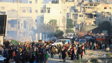 Palestinians carry their belongings and leave the eastern part of Gaza City after the Israeli army ordered them to evacuate. July 7, 2024